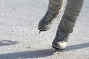 close up of ice skates on a rink Providence Moms Blog