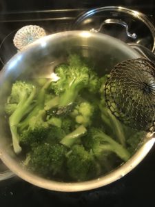 strainer and broccoli Providence Moms Blog