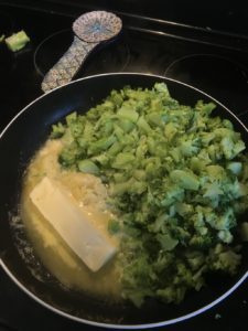 butter and broccoli in pan on stovetop Providence moms Blog