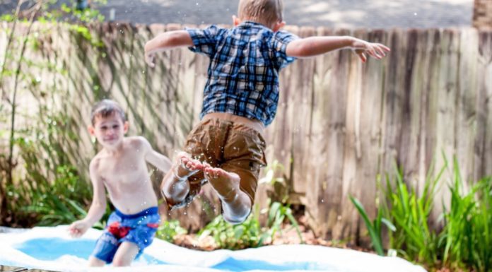 boys jumping into kiddie pool Providence Moms Blog