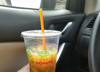 Holding Dunkin' Donuts Iced Coffee in Car Providence Moms Blog