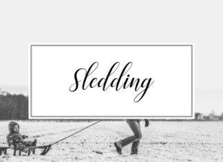 Picture of snowy background with a child being pulled on a sled and the words Sledding. Activities and things to do in Providence Rhode Island in the Winter