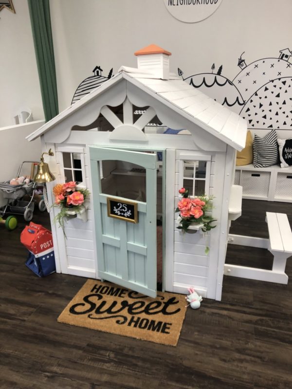 small white children playhouse at little seeds