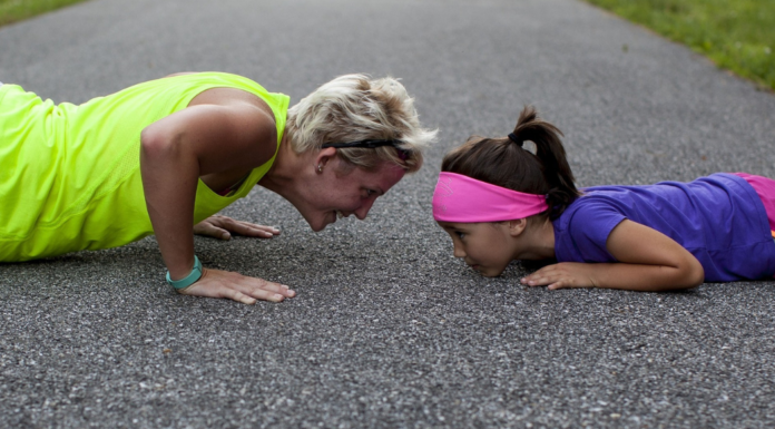 woman and child doing push ups