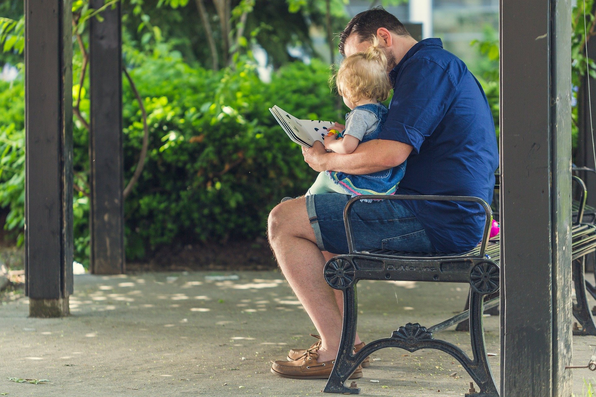 man and child reading outside | Springtime Books | providence mom