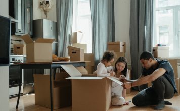 family surrounded by moving boxes
