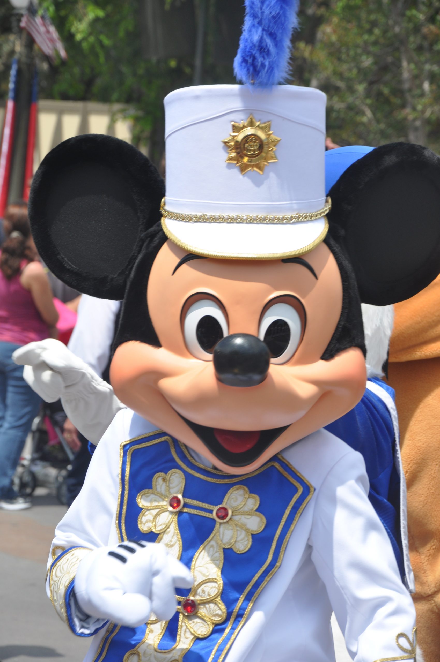 A shoulders up image of the Mickey Mouse mascot from Disney World 